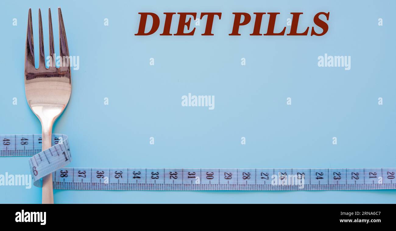 Diet text on flat lay background diet pills Stock Photo