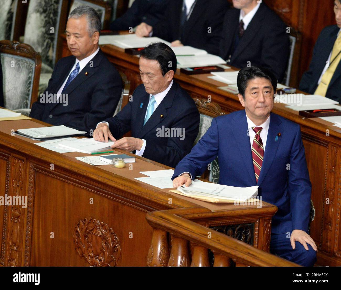 (160122) -- TOKYO, Jan. 22, 2016 -- Japanese Prime Minister Shinzo Abe (1st R) prepares to deliver his policy speech during a session of the House of Representatives in Tokyo, Japan, on Jan. 22, 2016. Japanese Prime Minister Shinzo Abe sought to gain more votes from lower income class for the upcoming upper house election by vowing to address wage gaps in his policy speech on Friday. ) JAPAN-TOKYO-ABE-POLICY SPEECH MaxPing PUBLICATIONxNOTxINxCHN   160122 Tokyo Jan 22 2016 Japanese Prime Ministers Shinzo ABE 1st r Prepares to Deliver His Policy Speech during a Session of The House of Representa Stock Photo
