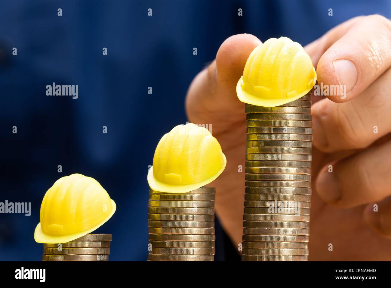Construction Insurance And Budget Inflation. Coin And Hard Hat Stock ...