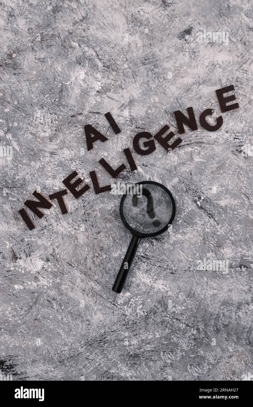 AI intelligence text with magnifying glass analysing a question mark, is machine learning really intelligent? Stock Photo