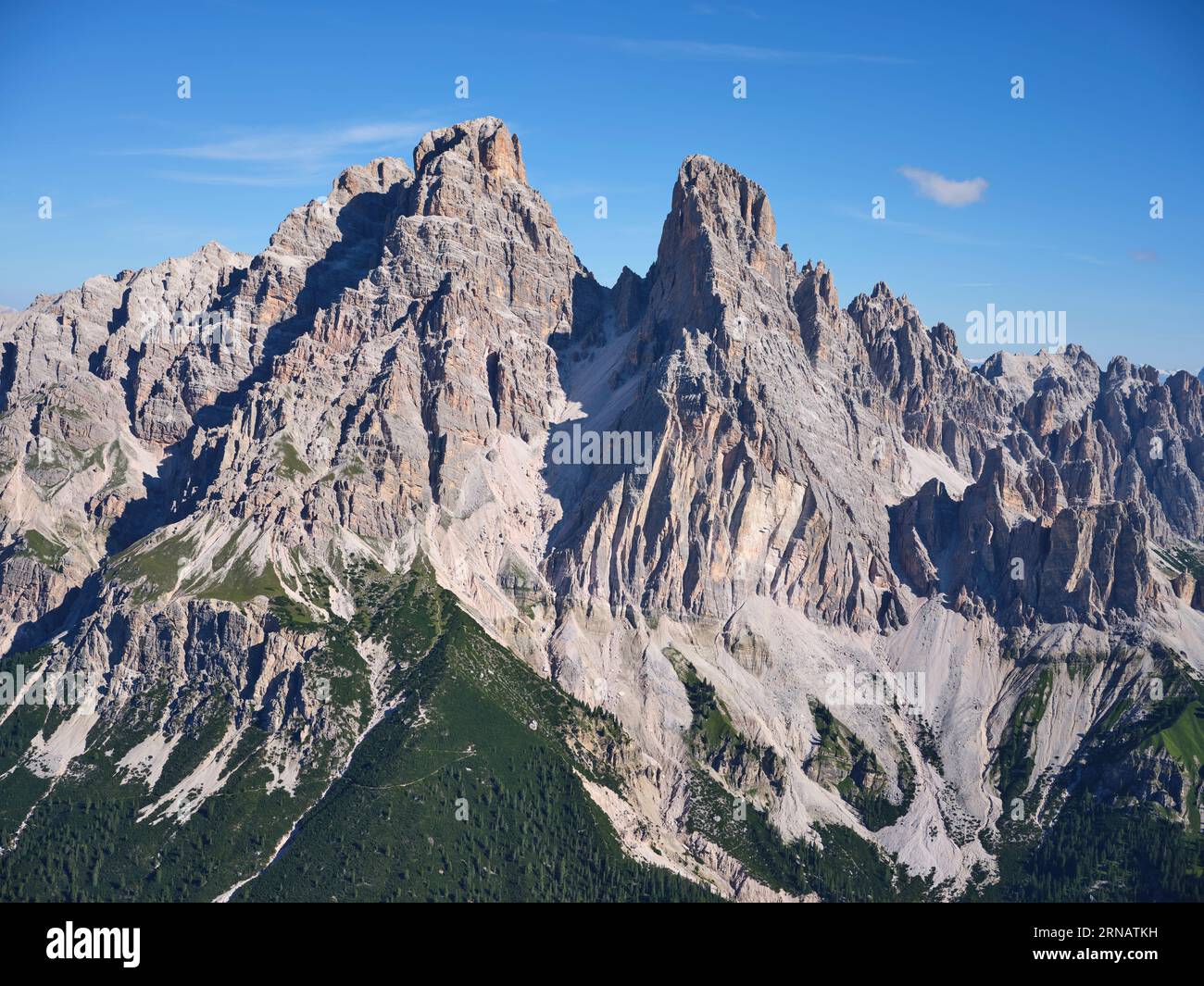 AERIAL VIEW. Southern face of Monte Cristallo (elevation: 3221m) in the Dolomites Mountains. Auronzo di Cadore, Province of Belluno, Veneto, Italy. Stock Photo