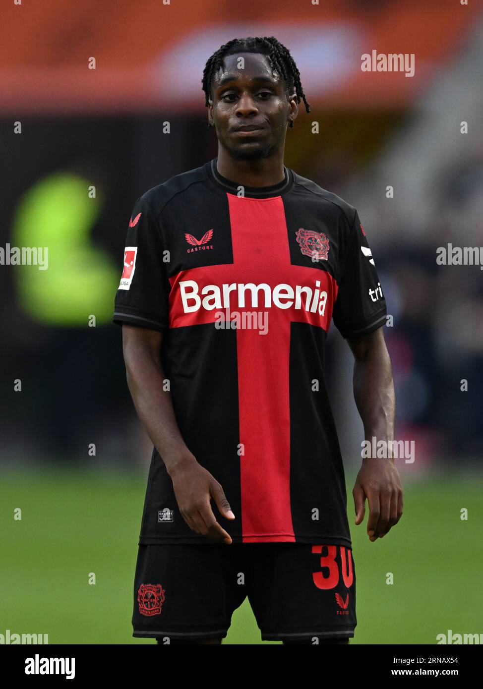 Jeremie FRIMPONG (Bayer 04 Leverkusen, #30) in a duel with Jakub KAMINSKI  (VfL Wolfsburg, #16), Stock Photo, Picture And Rights Managed Image. Pic.  PAH-321123917