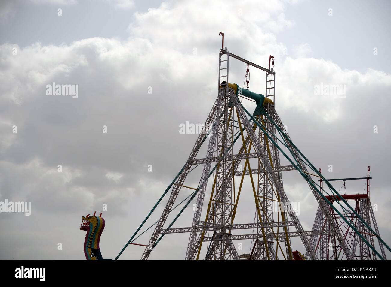 Rajkot, Gujarat, India 30-0-2023, A roller coaster is being built by workers for the largest fair in Saurashtra. Stock Photo