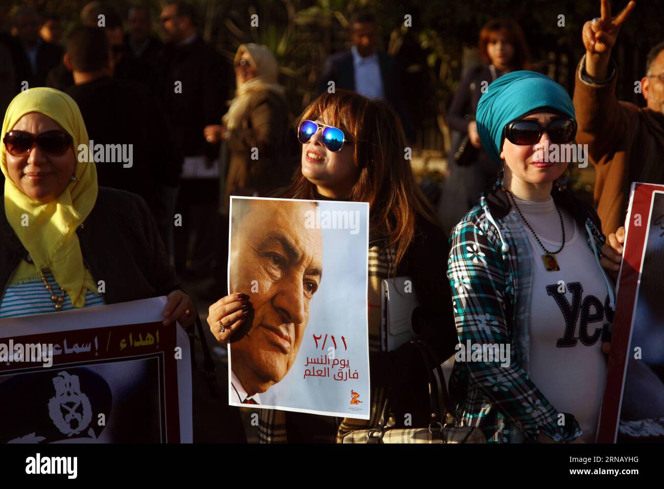 (160211) -- CAIRO, Feb.11, 2016 -- Supporters of Egypt s former President Hosni Mubarak hold posters during a protest marking the 5th anniversary of Mubarak s resignation outside Maadi Armed Forces Hospital in Cairo, Egypt on Feb.11,2016.) EGYPT-CAIRO-MUBARAK-PROTEST AhmedxGomaa PUBLICATIONxNOTxINxCHN   Cairo Feb 11 2016 Supporters of Egypt S Former President Hosni Mubarak Hold Posters during a Protest marking The 5th Anniversary of Mubarak S Resignation outside Maadi Armed Forces Hospital in Cairo Egypt ON Feb 11 2016 Egypt Cairo Mubarak Protest AhmedxGomaa PUBLICATIONxNOTxINxCHN Stock Photo