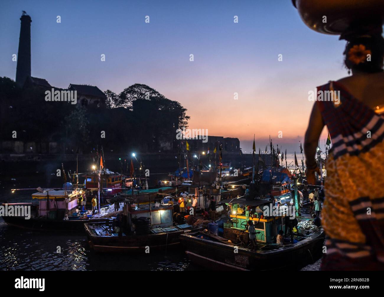 (160212) -- MUMBAI, Feb. 12, 2016 -- Fishing boats berth at Sassoon Dock to unload fresh seafood in southern Mumbai, India, Feb. 12, 2016. Sassoon Dock, established in 1875 and named after the famous Sassoon family, was the first commercial wet dock in western India and helped establish the cotton trade. It turned to a fish dock in the late 19th century and now is still the main fish loading and trading center in south Mumbai. ) INDIA-MUMBAI-SASSOON DOCK-FISH MARKET BixXiaoyang PUBLICATIONxNOTxINxCHN   160212 Mumbai Feb 12 2016 Fishing Boats Berth AT Sassoon Dock to unload Fresh Seafood in Sou Stock Photo