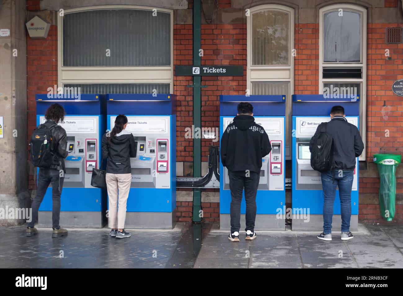 Slough, Berkshire, UK. 1st September, 2023. Passengers using self service ticket machines outside Slough Railway Office. It was a quiet morning at Slough Railway Station in Berkshire. Further rail strikes are taking place across rail networks in England today in an ongoing bitter dispute over pay and the proposed railway station ticket office closures. Elizabeth Line trains were, however, running to and from Abbey Wood in London today, however, many GWR trains were cancelled or delayed due to the Industrial Action. RMT Union members will also be on strike tomorrow. Credit: Maureen McLean/Alamy Stock Photo