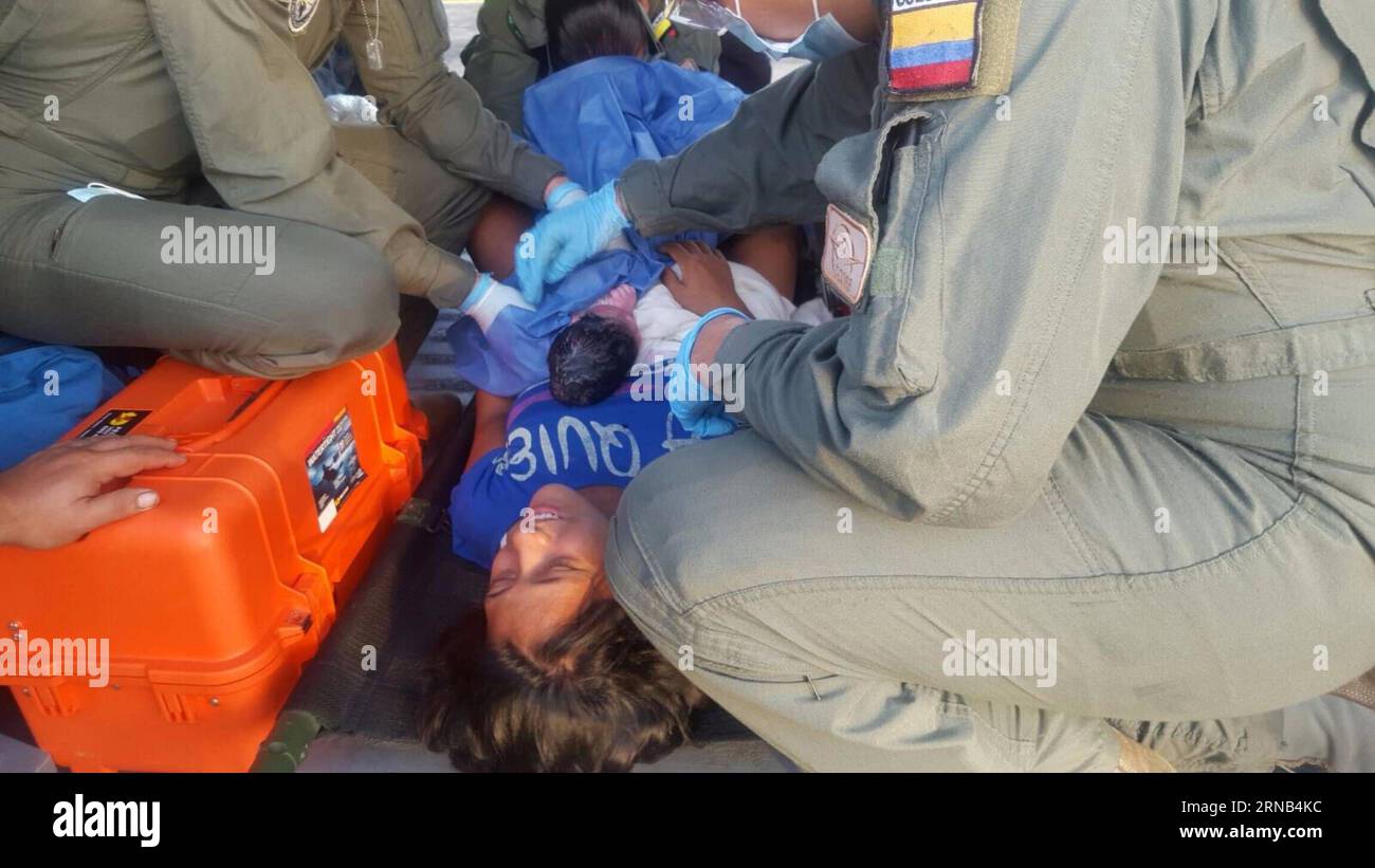 META, Feb. 18, 2016 -- Members of Colombian Air Force take care of Luz Elena Sosa (C), 23, and her baby that was born in an helicopter of the Air Force as the mother was tranferred from Mapiripan, Meta, to San Jose del Guaviare, Colombia, on Feb. 18, 2016. According to local press, the baby was born in a UH-60 Angel helicopter of Colombian Air Force when his mother was tranferred from Mapiripan, Meta department, to San Jose del Guaviare. Air Force in Meta/COLPRENSA) MANDATROY CREDIT NO ARCHIVE-NOT FOR SALE FOR EDITORIAL USE ONLY COLOMBIA OUT COLOMBIA-META-SOCIETY-BIRTH e COLPRENSA PUBLICATIONx Stock Photo