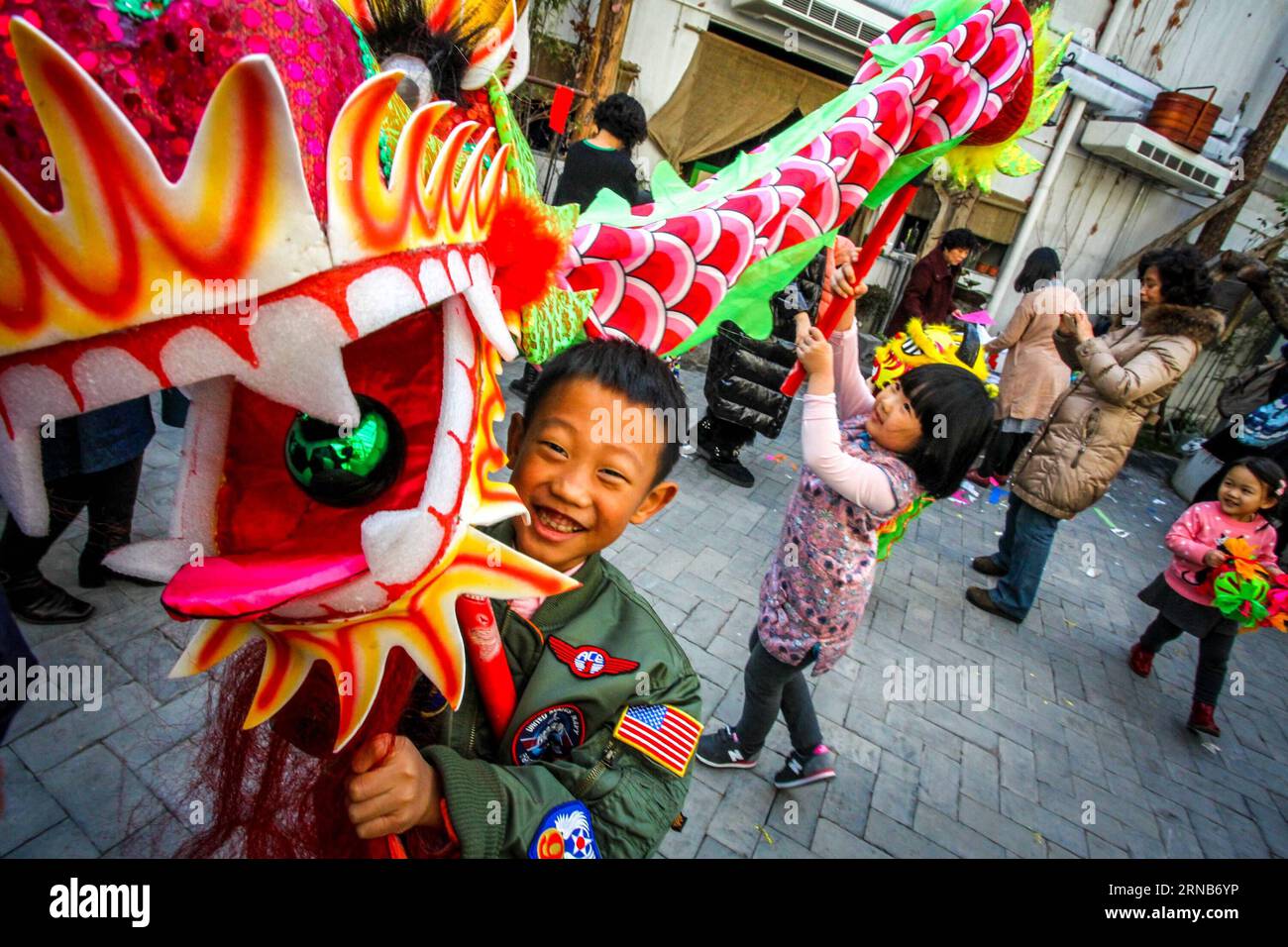 Children experience dragon dance at Ziyuan Art Park in Tianjin, north China, Feb. 21, 2016. Children experienced folk Chinese cultures here to celebrate the traditional Lantern Festival, the fifteenth day of the first month in the lunar calender. The Lantern Festival falls on Feb. 22 this year. ) (lfj) CHINA-TIANJIN-CHILDREN-FOLK CULTURES (CN) LixXiang PUBLICATIONxNOTxINxCHN   Children Experience Dragon Dance AT Ziyuan Art Park in Tianjin North China Feb 21 2016 Children experienced Folk Chinese Cultures Here to Celebrate The Traditional Lantern Festival The fifteenth Day of The First Month in Stock Photo