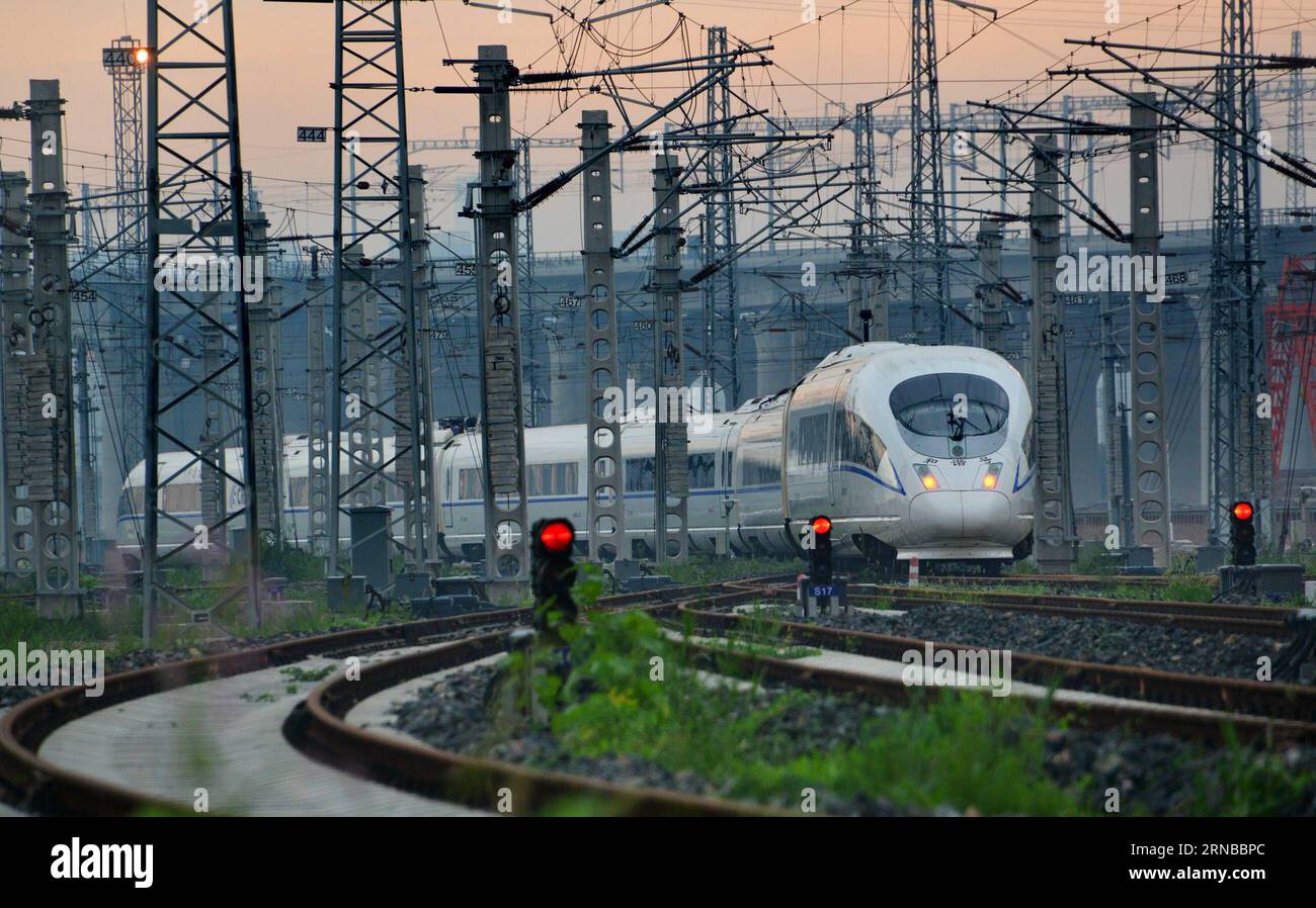 File photo taken on June 30, 2015 shows a bullet train running southbound to Shanghai s Hongqiao Railway Station. Building more high-speed railways has been a hot topic at the annual sessions of China s provincial legislatures and political advisory bodies intensively held in January. China has the world s largest high-speed rail network, with the total operating length reaching 19,000 km by the end of 2015, about 60 percent of the world s total. The expanding high-speed rail network is offering unprecedented convenience and comfort to travelers, and boosting local development as well. Chinese Stock Photo