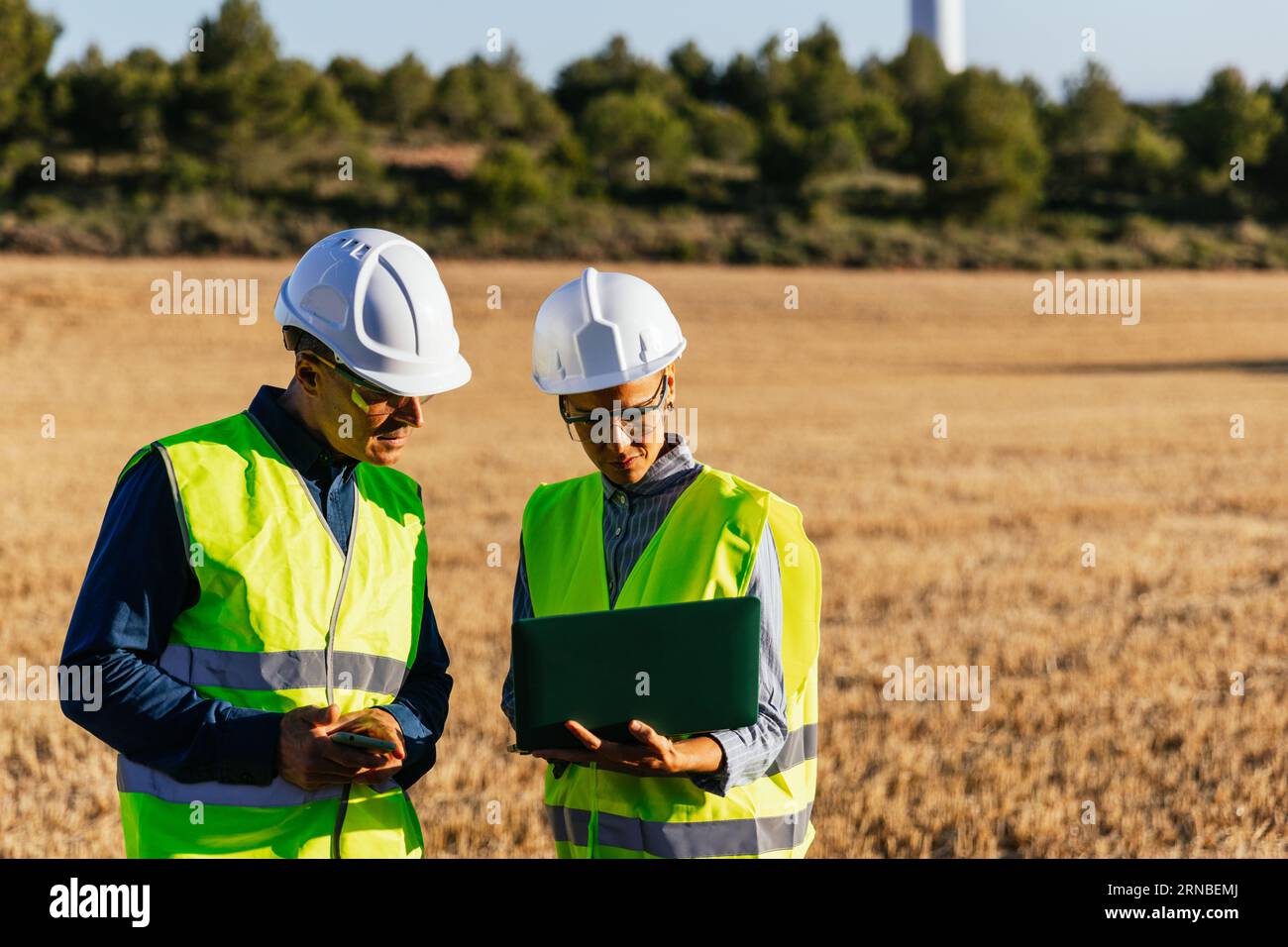 Expert engineers in wind energy production Stock Photo - Alamy