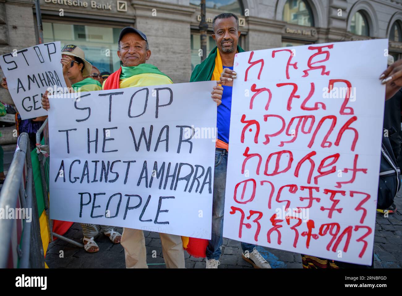 Rome, Italy. 31st Aug, 2023. Two Ethiopian men of the Amhara ethnic group hold a sign calling for an end to the war against the Amhara people and a sign in Amharic during the protest demonstration against the persecution of the Amhara in Ethiopia which took place in Rome. According to the United Nations High Commissioner for Human Rights (OHCHR), at least 183 people have been killed in clashes in the Amhara region. After the proclamation of the state of emergency at least 1,000 people were arrested: many belonging to the Amhara ethnic group and suspected of supporting the Fano militias ('volu Stock Photo