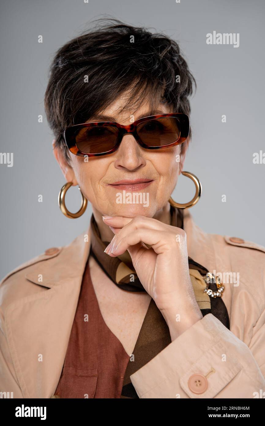 Hoop earrings and mature woman hi-res stock photography and images - Alamy