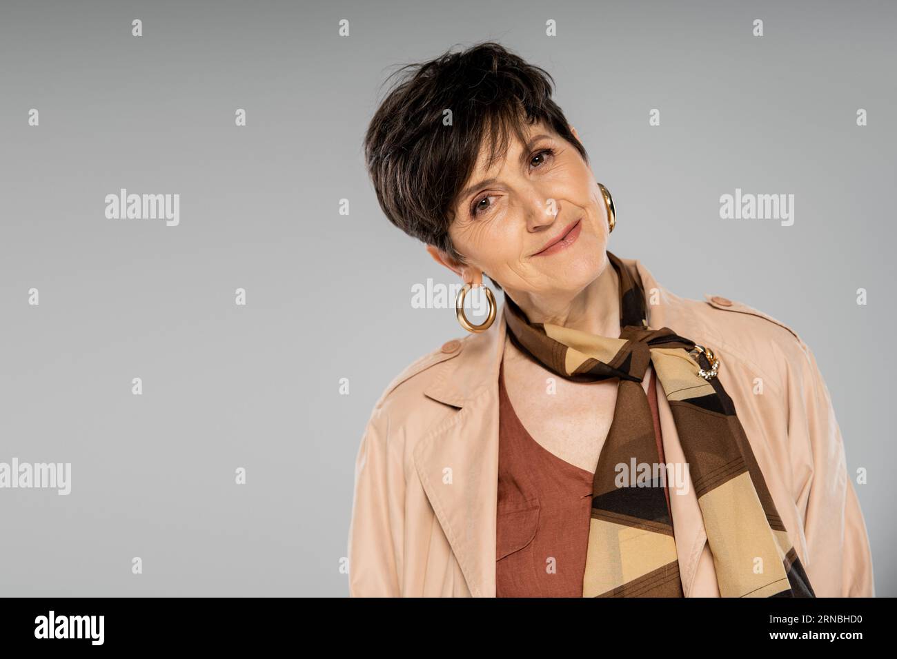 Hoop earrings and mature woman hi-res stock photography and images - Alamy