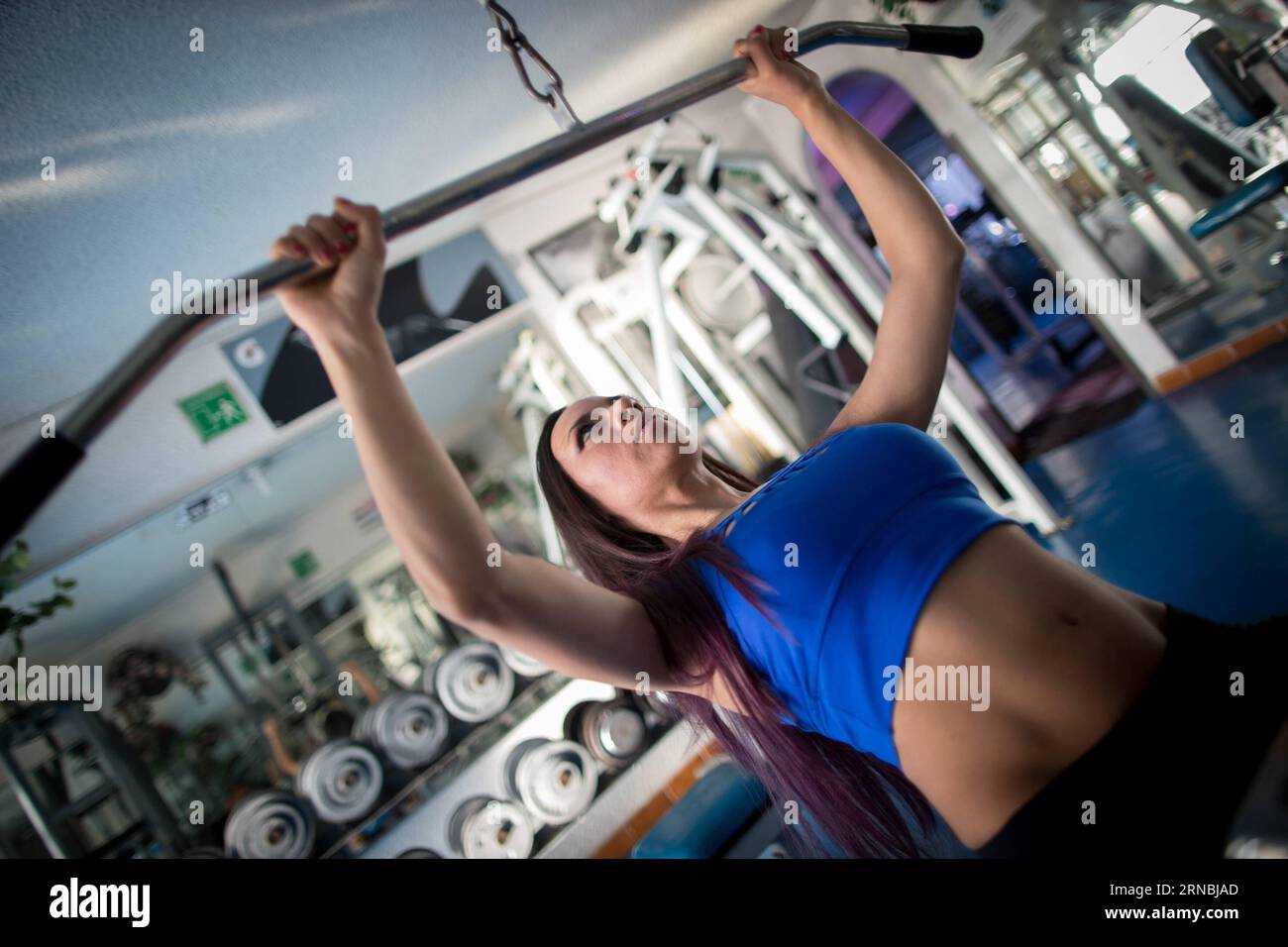 (160307) -- MEXICO CITY, March 7, 2016 -- Photo taken on March 4, 2016 shows Susana Zambrano, the national champion of fitness, training in a gym in Mexico City, capital of Mexico. Lacking support from her family, Susana has spent the last decade in bodybuilding which is still an exclusive for men in the country. I m sad because my mom and grandmom don t understand why I love bodybuilding, but I must respect them . The upcoming International Women s Day will be celebrated under the theme Planet 50-50 by 2030: Step it Up for Gender Equality , with special attention to equal opportunities in edu Stock Photo