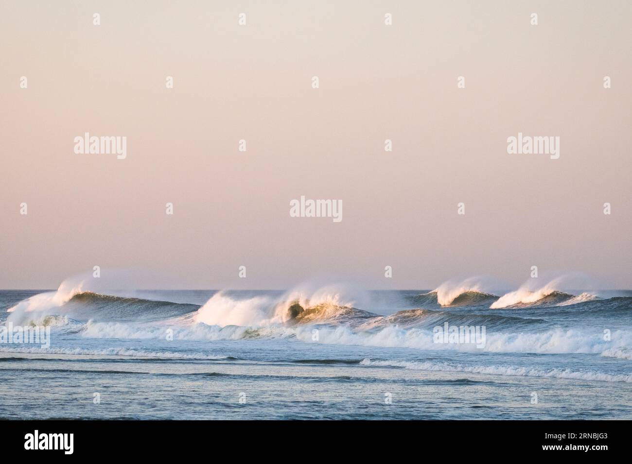 Big Ocean Waves at Sunset Stock Photo