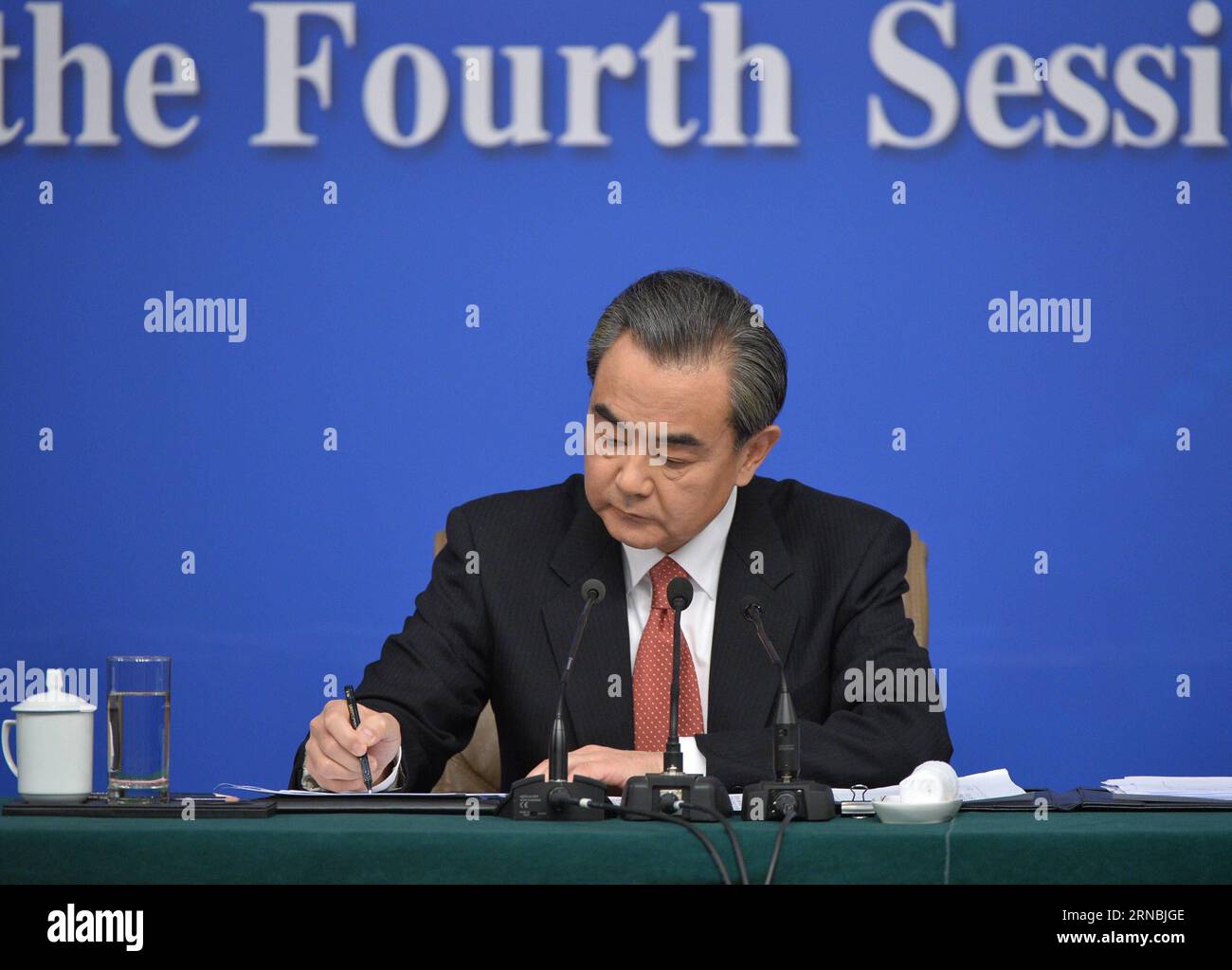 (160308) -- BEIJING, March 8, 2016 -- Chinese Foreign Minister Wang Yi jots down questions from journalists during a press conference on China s foreign policy and foreign relations on the sidelines of the fourth session of China s 12th National People s Congress in Beijing, capital of China, March 8, 2016. )(mcg) (TWO SESSIONS)CHINA-BEIJING-NPC-PRESS CONFERENCE-WANG YI (CN) LixXin PUBLICATIONxNOTxINxCHN   Beijing March 8 2016 Chinese Foreign Ministers Wang Yi jots Down Questions from Journalists during a Press Conference ON China S Foreign Policy and Foreign relations ON The Sideline of The F Stock Photo
