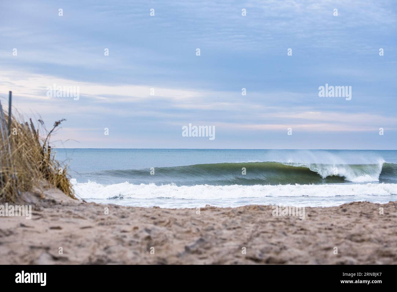 Ocean Waves at Sunrise on a Winter Day at the Beach Stock Photo