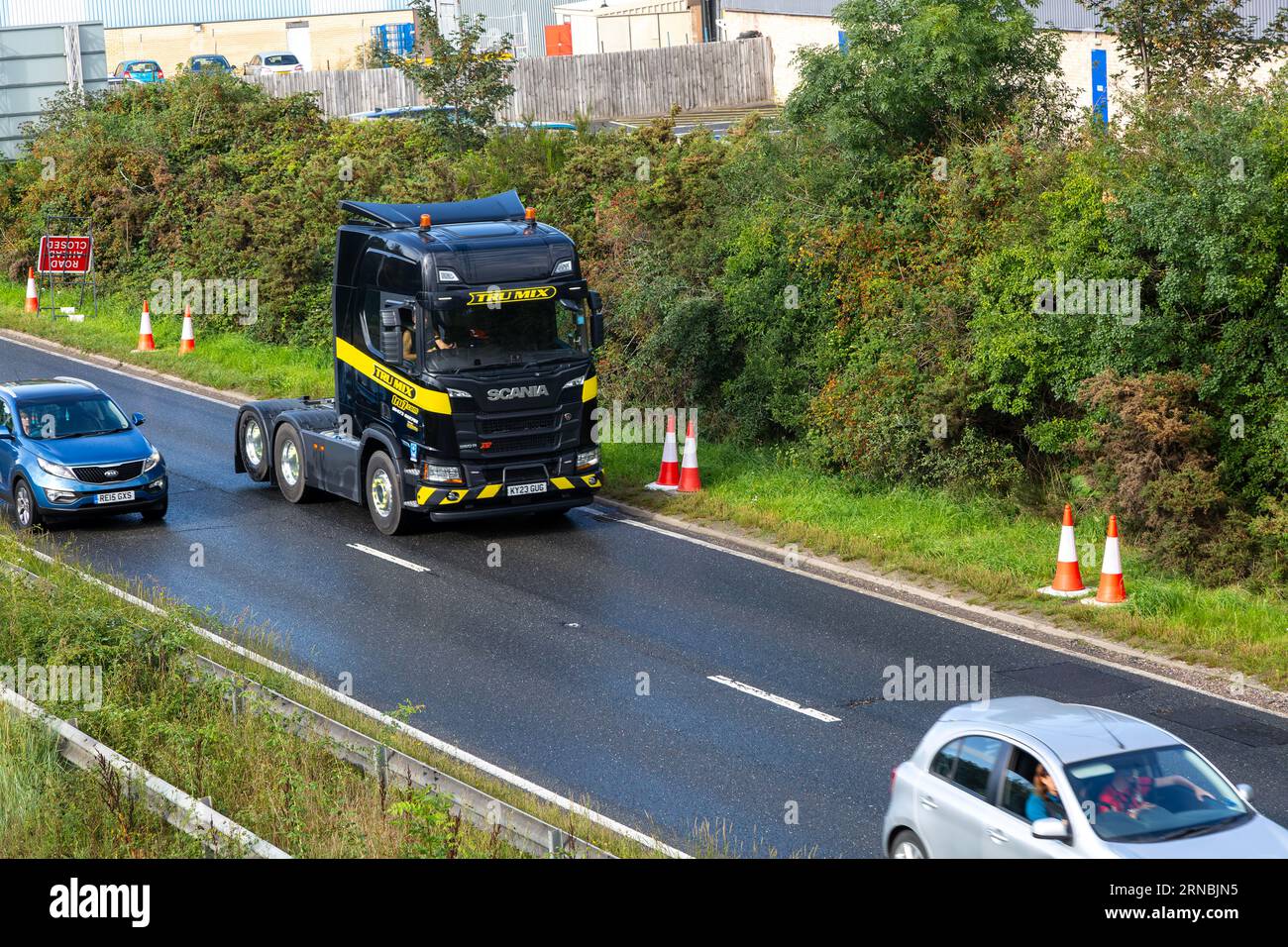 Tru Mix Scania lorry HGV cab, A12 dual carriageway main road, Martlesham, Suffolk, England, UK Stock Photo