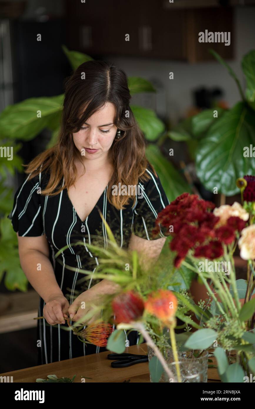 Woman pruning flowers for bouquet Stock Photo