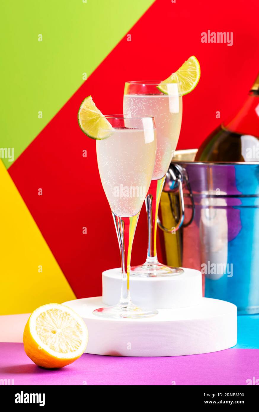 French 75 cocktail with dry gin, prosecco wine, syrup, lime and lemon