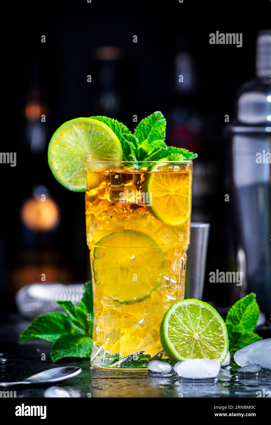 Dark and Stormy cocktail drink with dark rum, ginger ale, lime and ice