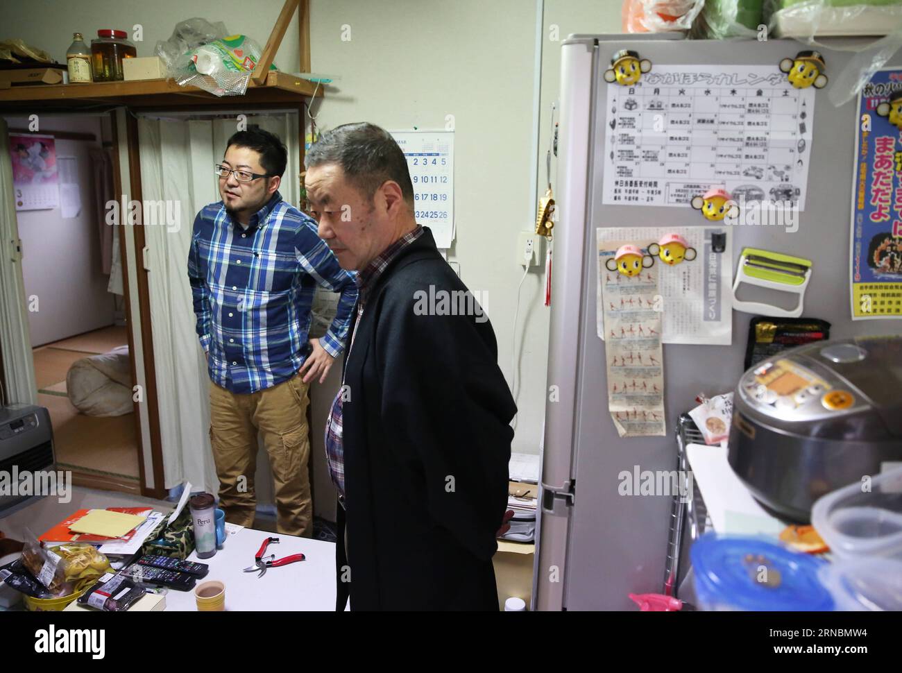 (160309)-- TOKYO, March 9, 2016-- A family of evacuees receives interview at a temporary house for evacuees of the earthquake of March 11, 2011 in Iwate, Japan, on March 5, 2016. As the five-year intensive reconstruction period approaches its deadline in late March, the Japanese Tohoku region devastated by a monstrous earthquake-triggered tsunami on March 11, 2011 is still struggling to be revitalized, with a declining population making the huge projects ever harder to complete. )(azp) JAPAN-EARTHQUAKE-TEMPORARY HOUSES LiuxTian PUBLICATIONxNOTxINxCHN   Tokyo March 9 2016 a Family of Evacuees r Stock Photo