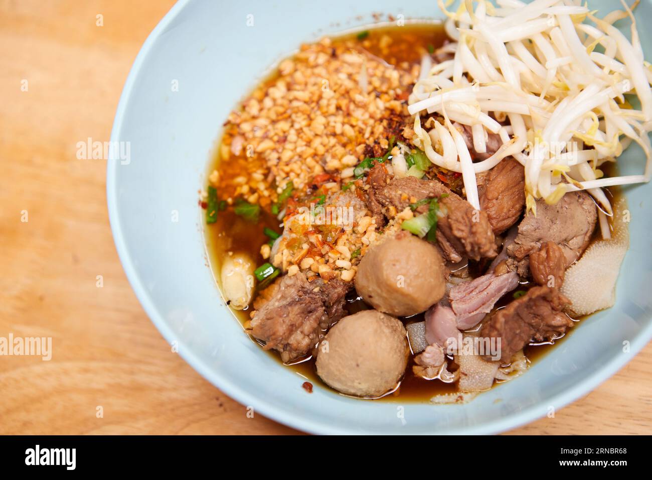 Rice stick noodles with braised beef and meatball in a bowl Stock Photo