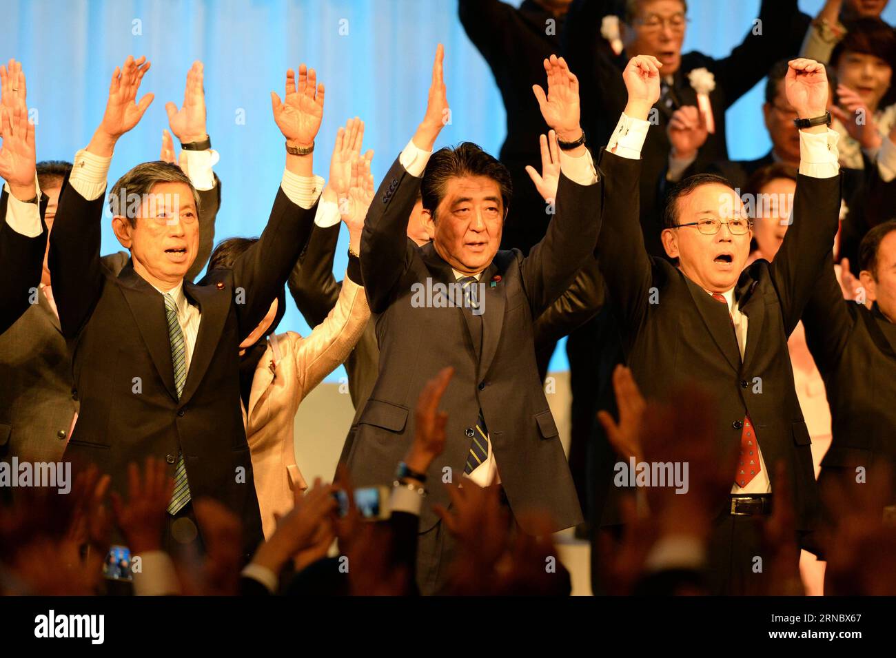 (160313) -- TOKYO, March 13, 2016 -- Japanese Prime Minister Shinzo Abe (C) shouts slogans with members of his ruling Liberal Democratic (LDP) Party during its annual convention in Tokyo, Japan, March 13, 2016. The LDP held its 83rd convention here on Sunday. ) JAPAN-POLITICS-LDP-ANNUAL CONVENTION MaxPing PUBLICATIONxNOTxINxCHN   Tokyo March 13 2016 Japanese Prime Ministers Shinzo ABE C Shouts Slogans With Members of His ruling Liberal Democratic LDP Party during its Annual Convention in Tokyo Japan March 13 2016 The LDP Hero its 83rd Convention Here ON Sunday Japan POLITICS LDP Annual Convent Stock Photo