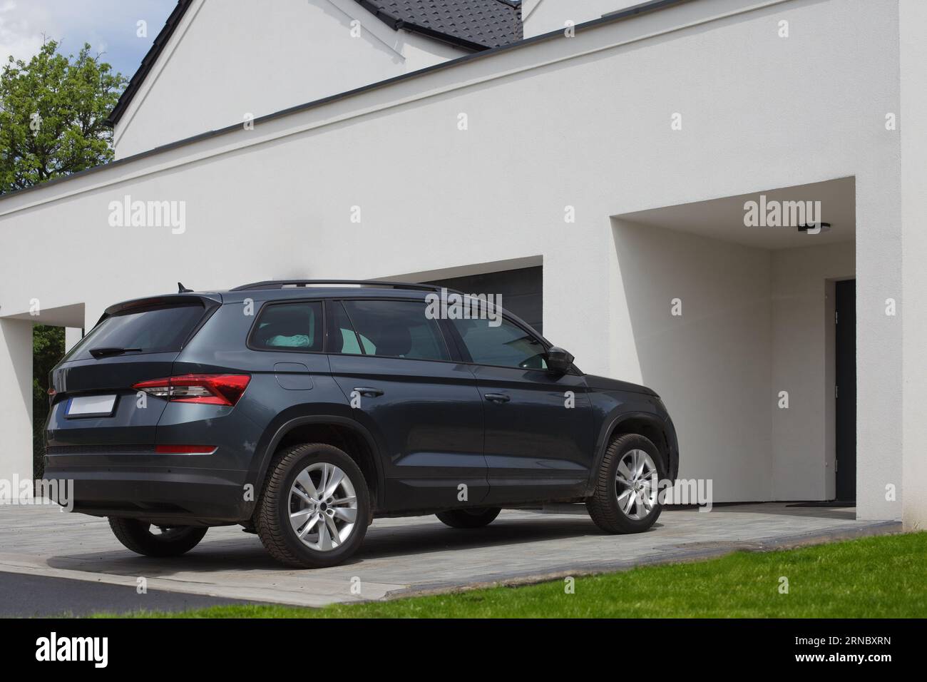 SUV car parked in front of a residence, apartment. Stock Photo