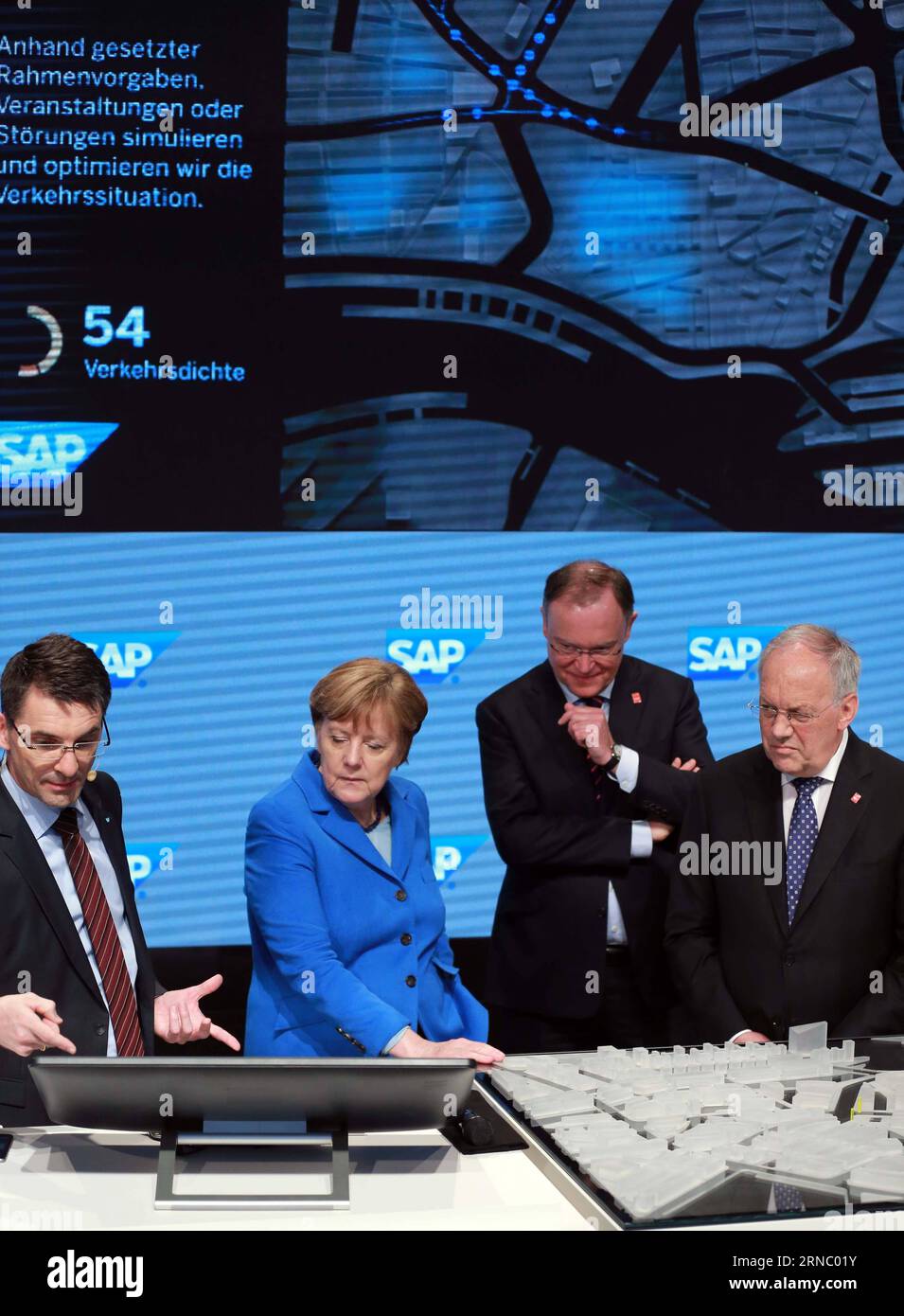 (160315) -- HANOVER, March 15, 2016 -- German chancellor Angela Merkel (2nd L) and Swiss President Johann Schneider-Ammann (1st R) visit the SAP booth during their visit to the CeBIT 2016 in Hanover, central Germany, on March 15, 2016. Switzerland is the partner country of the CeBIT 2016. ) GERMANY-HANOVER-CEBIT-SWITZERLAND LuoxHuanhuan PUBLICATIONxNOTxINxCHN   Hanover March 15 2016 German Chancellor Angela Merkel 2nd l and Swiss President Johann Schneider Ammann 1st r Visit The SAP Booth during their Visit to The CeBit 2016 in Hanover Central Germany ON March 15 2016 Switzerland IS The Partne Stock Photo