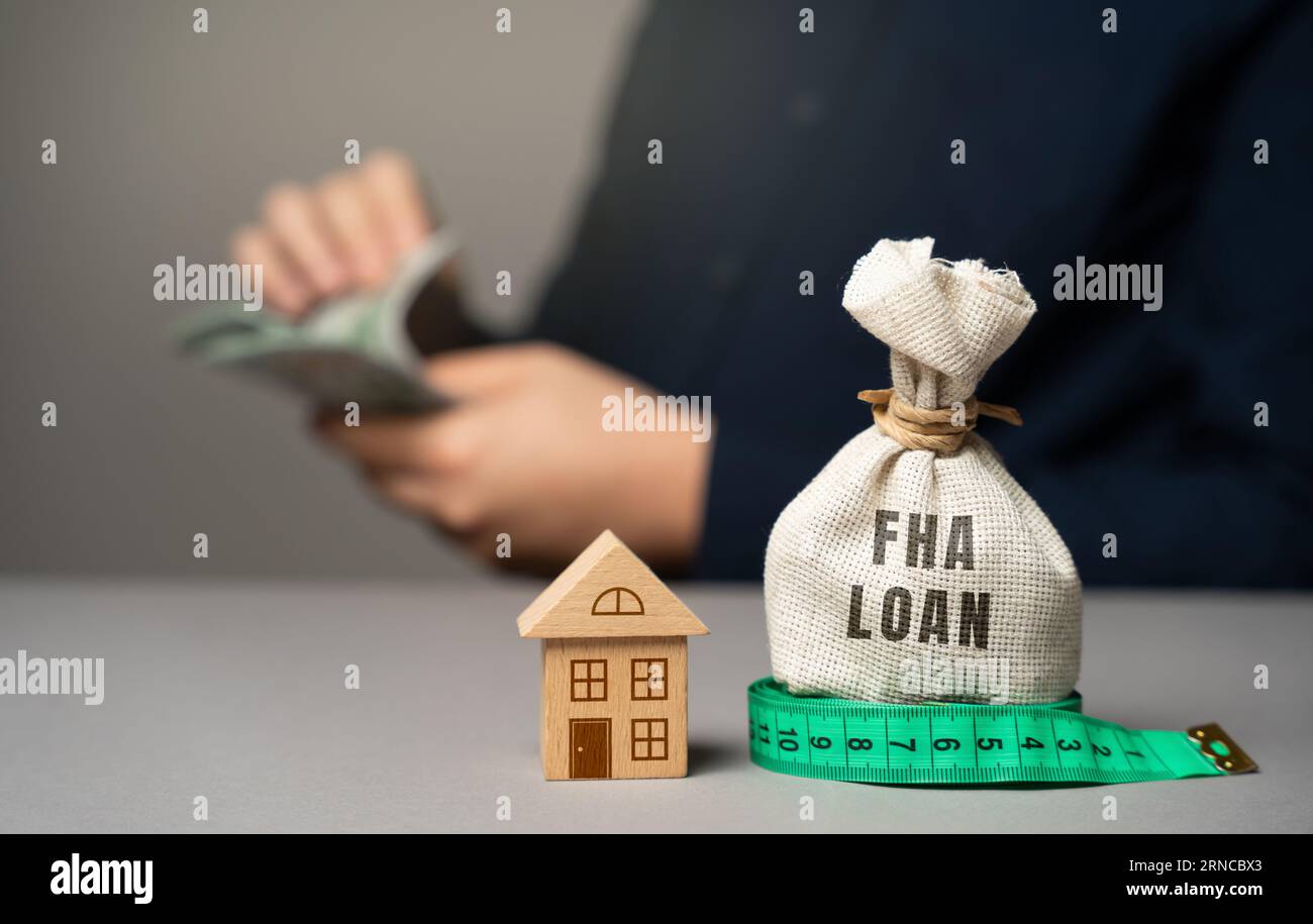 FHA loan concept. Mortgage insured by Federal Housing Administration Loan. Affordable loans for borrowers with a low credit score. Down payment. Purch Stock Photo