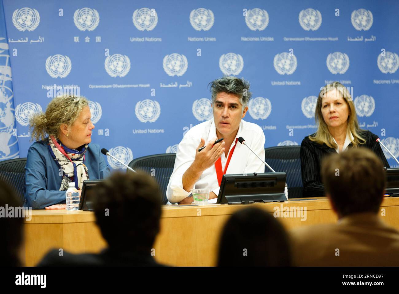 (160405) -- NEW YORK, April 5, 2016 -- Alejandro Aravena, Chilean architect and winner of the Pritzker Architecture Prize for 2016, briefs journalists on the link between architecture and sustainable development, at the United Nations headquarters in New York, April 5, 2016. He is flanked by Paloma Duran (L), director of the Sustainable Development Goals Fund at the UN Development Programme (UNDP) and Martha Thorne, executive director of the Pritzker Architecture Prize. The Sustainable Development Goals Fund (SDGF) and Pritzker Architecture Prize laureate Alejandro Aravena draw on the role of Stock Photo