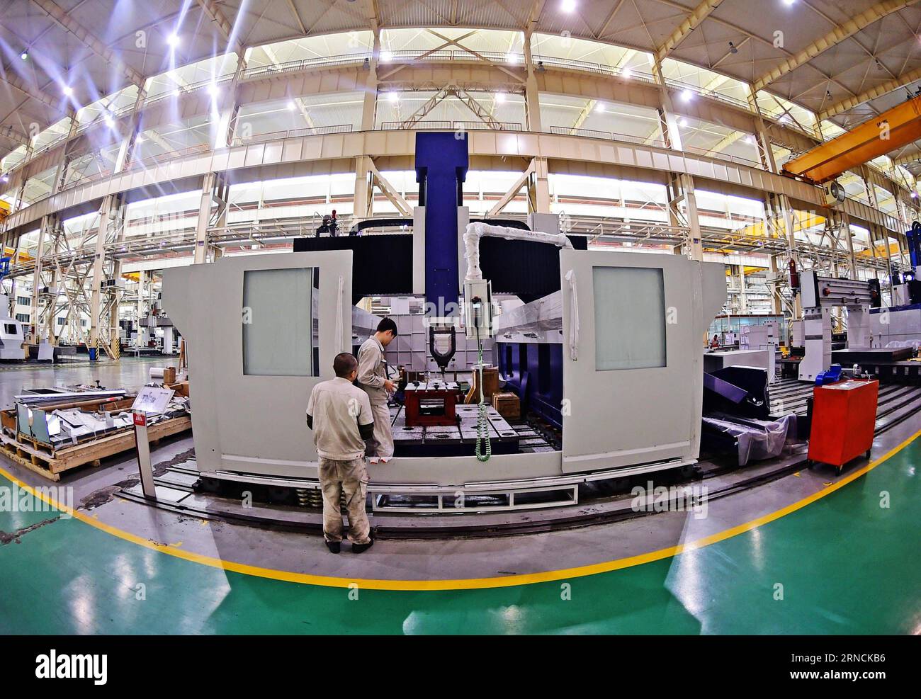 (160415) -- SHENYANG, April 15, 2016 -- People work at a factory of Shenyang Machine Tool Co., Ltd. March 28, 2016 in Shenyang, capital of northeast China s Liaoning Province. China s GDP stood at 15.9 trillion RMB yuan (2.4 trillion U.S. dollars) in the first quarter this year, growing up by 6.7 percent year on year, the National Bureau of Statistics said on April 15, 2016. ) (zwx) CHINA-GDP-GROWTH RATE (CN) YangxQing PUBLICATIONxNOTxINxCHN   160415 Shenyang April 15 2016 Celebrities Work AT a Factory of Shenyang Machine Tool Co Ltd March 28 2016 in Shenyang Capital of Northeast China S Liaon Stock Photo