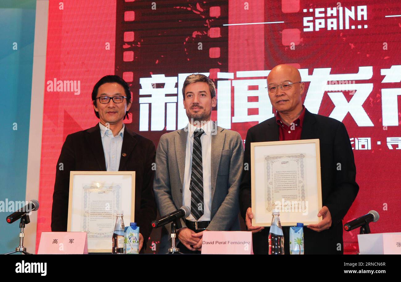(160417) -- BEIJING, April 17, 2016 -- David Peral Fernandez (C), cultural minister of the Andalucia region in Spain, issues letters of appointment to Chinese filmmaker Gao Jun (R) and Beijing Film Academy professor Su Mu during a press conference of the first Sino-Spanish film culture exchange project in Beijing, capital of China, April 17, 2016. According to the project, ten Chinese films will be shown during the first Sino-Spanish film week in majors cities of Spain s Andalucia region in November of 2016. Moreover, the Barcelona government will invite Chinese young directors for a one-month Stock Photo