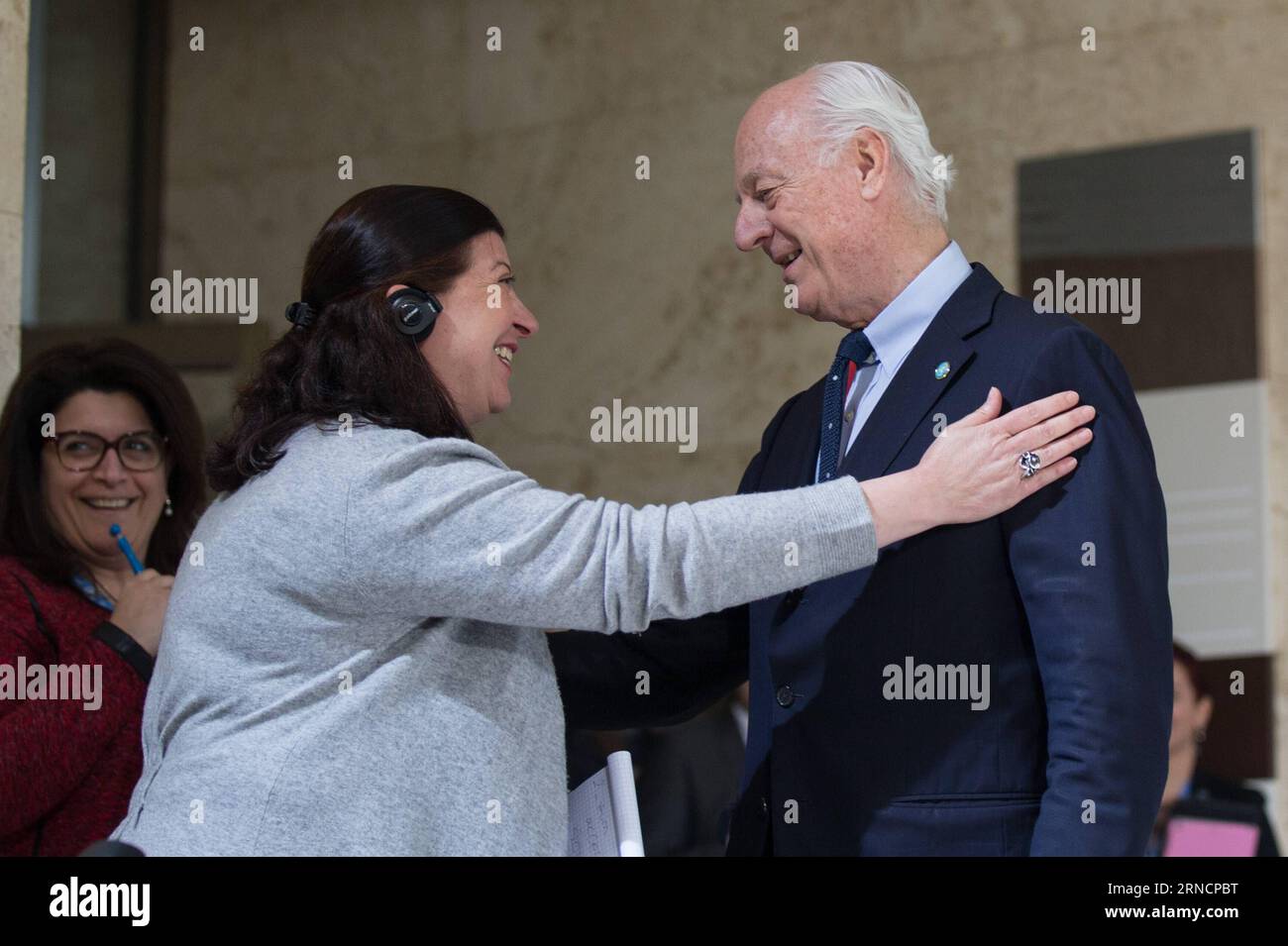 (169418) -- GENEVA, April 18, 2016 -- UN Special Envoy for Syria Staffan de Mistura (R) expresses his apologies to an interpreter for his using long sentences during a press conference in Geneva, Switzerland, April 18, 2016. UN Special Envoy for Syria Staffan de Mistura on Monday said that the main Syrian opposition delegation, the High Negotiation Committee or HNC, is intending to suspend their formal presence to the ongoing peace talks in the UN headquarters of the Palace des Nations, but will remain staying in Geneva for technical discussions. ) SWITZERLAND-GENEVA-SYRIA TALKS XuxJinquan PUB Stock Photo