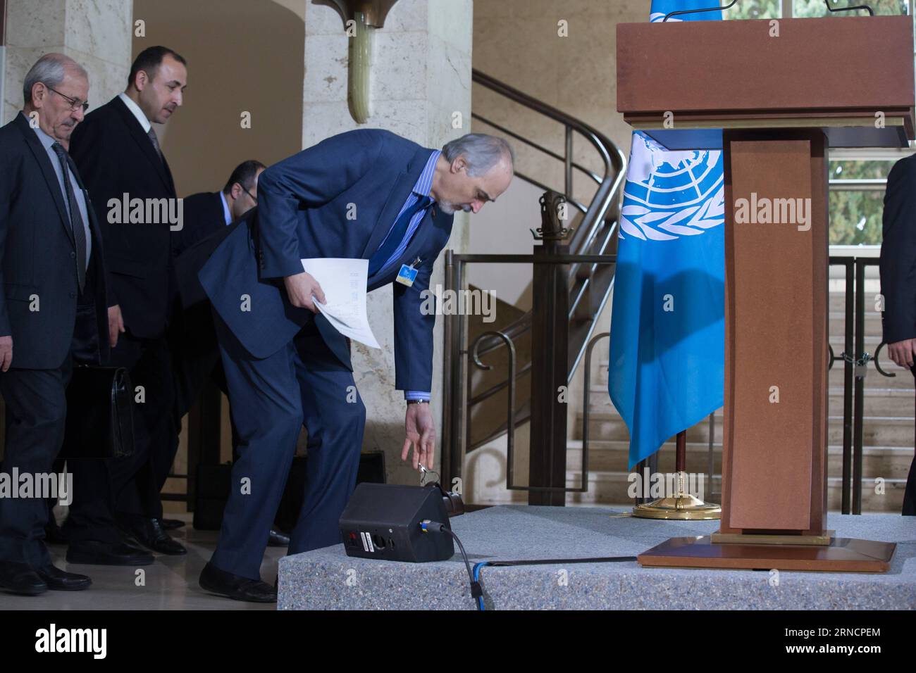 (169418) -- GENEVA, April 18, 2016 -- Head of the Syrian government delegation Bashar Jaafari(1st R) lays his briefcase while arriving at a press conference at Palais des Nations in Geneva, Switzerland, April 18, 2016. UN Special Envoy for Syria Staffan de Mistura on Monday said that the main Syrian opposition delegation, the High Negotiation Committee or HNC, is intending to suspend their formal presence to the ongoing peace talks in the UN headquarters of the Palace des Nations, but will remain staying in Geneva for technical discussions. ) SWITZERLAND-GENEVA-SYRIA TALKS XuxJinquan PUBLICATI Stock Photo