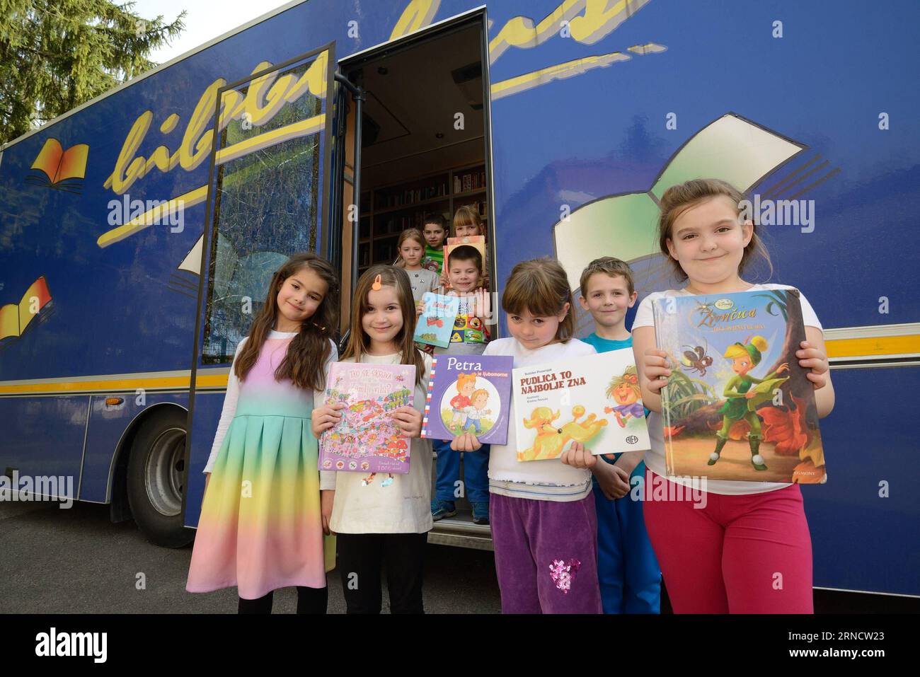 ZAGREB, April 06, 2016 -- Kids from Gracani elementary school show books borrowed from a Bibliobus mobile library in Gracani near Zagreb, capital of Croatia, April 6, 2016. The Bibliobus is a mobile library service organized by Zagreb City Library, covering 78 points in the city and its surrounding. ) CROATIA-ZAGREB-MOBILE LIBRARY SERVICE MisoxLisanin PUBLICATIONxNOTxINxCHN   Zagreb April 06 2016 Kids from Gracani Elementary School Show Books borrowed from a  Mobile Library in Gracani Near Zagreb Capital of Croatia April 6 2016 The  IS a Mobile Library Service Organized by Zagreb City Library Stock Photo