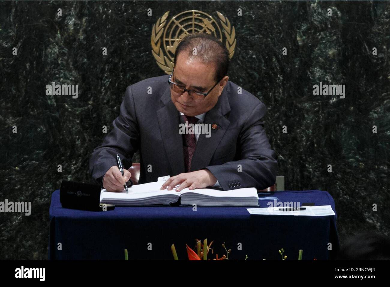 160422 -- UNITED NATIONS, April 22, 2016 -- Ri Su Yong, foreign minister of the Democratic People s Republic of KoreaDPRK signs the Paris climate agreement at the United Nations headquarters in New York, April 22, 2016. The landmark Paris climate pact opened for signatures by leaders from 171 countries Friday morning, marking the first step toward the pact s entry into force.  UN-PARIS AGREEMENT-SIGNING CEREMONY LixMuzi PUBLICATIONxNOTxINxCHN Stock Photo