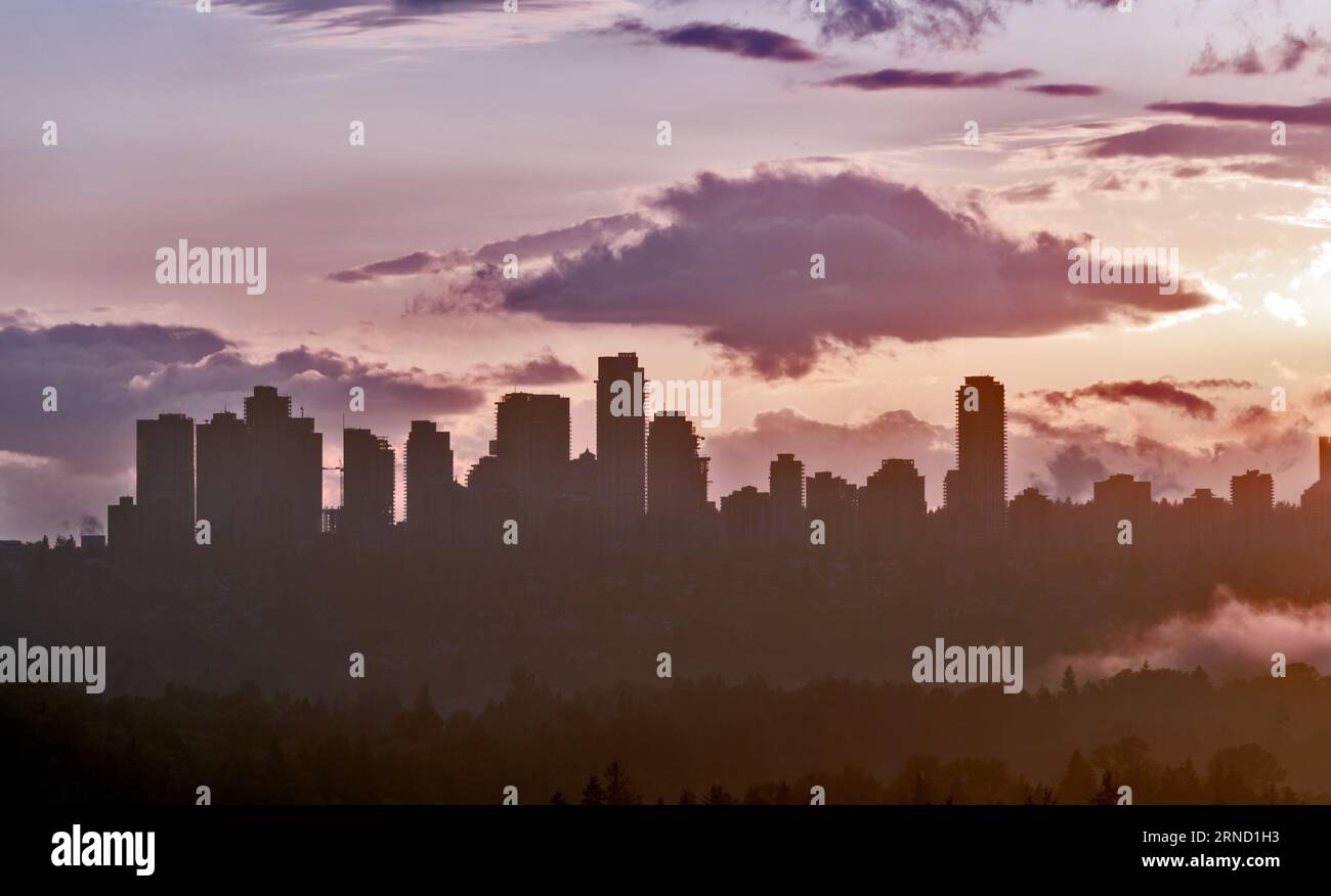 Urban cityscape silhouette on sunset sky background Stock Photo - Alamy