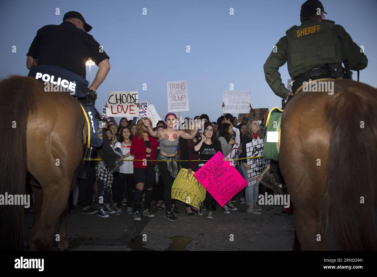 Protesters react outside a Donald Trump campaign rally in Orange County, southern California, April 28, 2016. Supporters and opponents of the Republican presidential front-runner Donald J. Trump confronted for a few hours on Thursday to express their different opinions. ) US-ORANGE COUNTY-TRUMP-PROTEST yangxlei PUBLICATIONxNOTxINxCHN   protesters react outside a Donald Trump Campaign Rally in Orange County Southern California April 28 2016 Supporters and opponents of The Republican Presidential Front Runner Donald J Trump confronted for a few Hours ON Thursday to Shipping their different opini Stock Photo