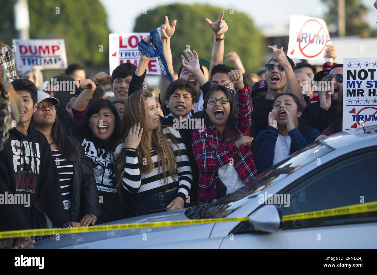 Protesters shout outside a Donald Trump campaign rally in Orange County, southern California, April 28, 2016. Supporters and opponents of the Republican presidential front-runner Donald J. Trump confronted for a few hours on Thursday to express their different opinions. ) US-ORANGE COUNTY-TRUMP-PROTEST yangxlei PUBLICATIONxNOTxINxCHN   protesters Shout outside a Donald Trump Campaign Rally in Orange County Southern California April 28 2016 Supporters and opponents of The Republican Presidential Front Runner Donald J Trump confronted for a few Hours ON Thursday to Shipping their different opini Stock Photo