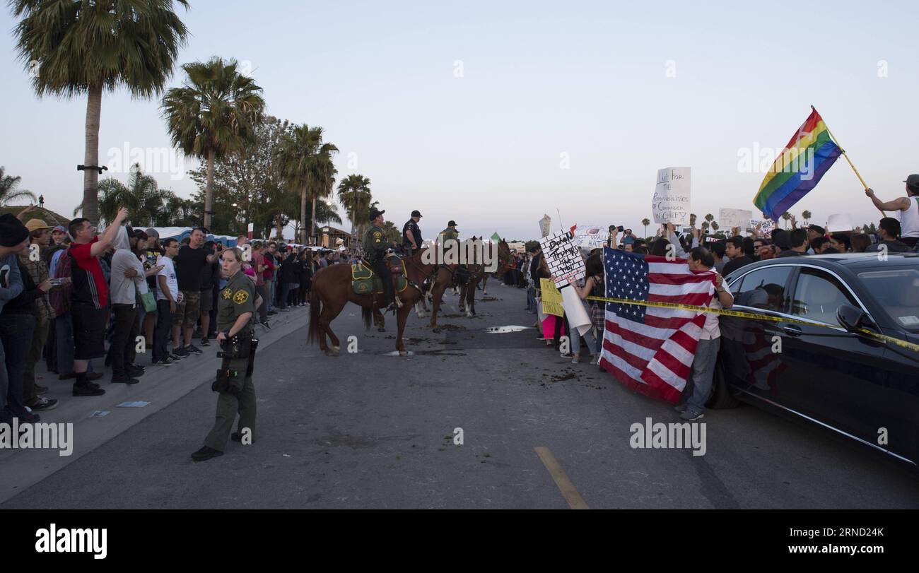 People protest outside a Donald Trump campaign rally in Orange County, southern California, April 28, 2016. Supporters and opponents of the Republican presidential front-runner Donald J. Trump confronted for a few hours on Thursday to express their different opinions. ) US-ORANGE COUNTY-TRUMP-PROTEST yangxlei PUBLICATIONxNOTxINxCHN   Celebrities Protest outside a Donald Trump Campaign Rally in Orange County Southern California April 28 2016 Supporters and opponents of The Republican Presidential Front Runner Donald J Trump confronted for a few Hours ON Thursday to Shipping their different opin Stock Photo