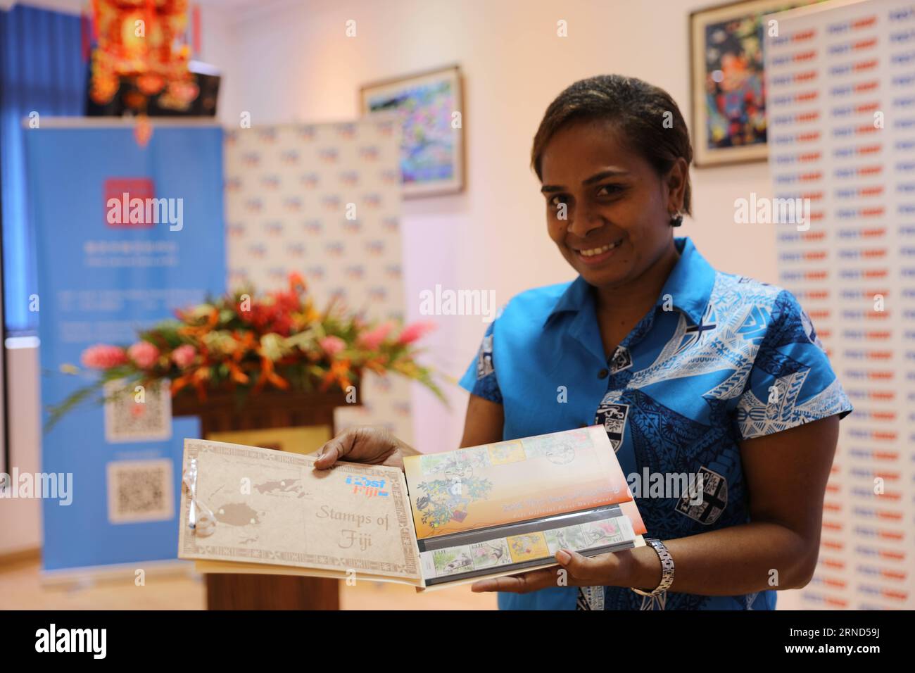 (160504) SUVA, May 4, 2016 A Post Fiji Limited employee showcases monkeythemed stamps and
