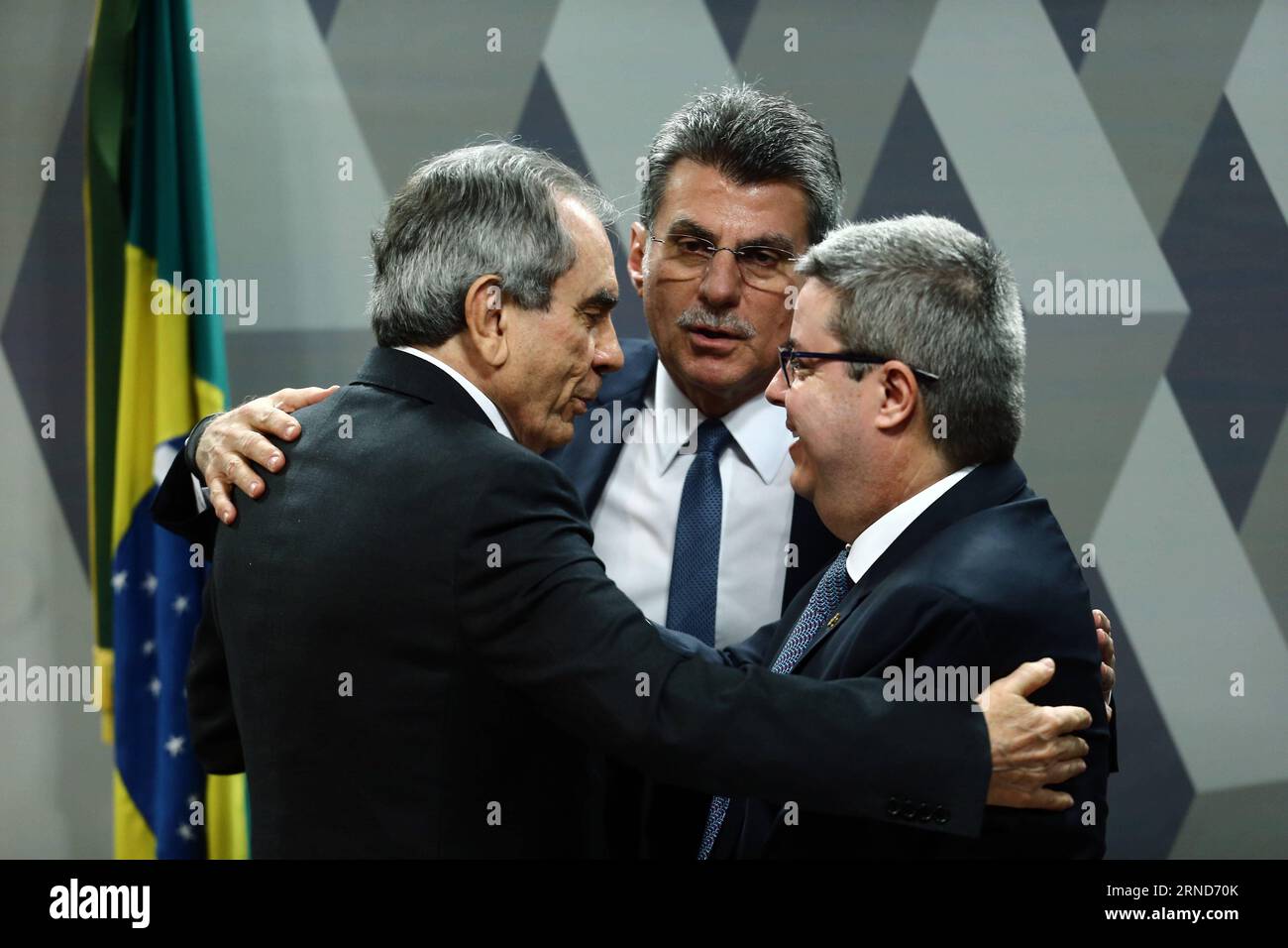 (160506) -- BRASILIA, May 6, 2016 -- Senator Raimundo Lira (L), member of Brazilian Democratic Movement Party (PMDB) and the president of a special senate committee that will consider Brazil s President Dilma Rousseff s impeachment, Senator Romero Juca (C) from PMDB, and Senator Antonio Anastasia (R), member of Brazilian Social Democratic Party (PSDB) and the rapporteur of the committee, have talks during the vote session of the report on impeachment proceedings in Brasilia, Brazil, on May 6, 2016. A Brazilian Senate committee voted on Fiday in favor of opening an impeachment against President Stock Photo