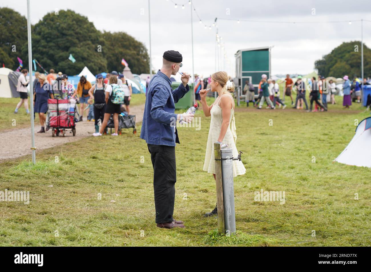 Dorset, UK. Friday, 1 September, 2023. Two festival goers brushing their teeth at the 2023 edition of the End of the Road festival at Larmer Tree Gardens in Dorset. Photo date: Friday, September 1, 2023. Photo credit should read: Richard Gray/Alamy Live News Stock Photo