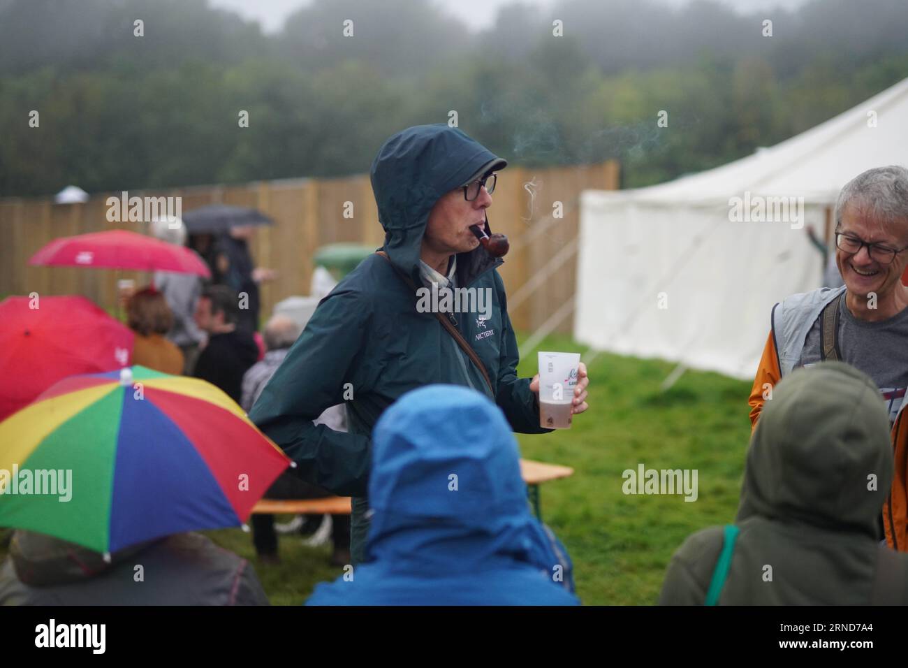 Dorset, UK. Thursday, 31 August, 2023. A man smoking a pipe at the 2023 edition of the End of the Road festival at Larmer Tree Gardens in Dorset. Photo date: Thursday, August 31, 2023. Photo credit should read: Richard Gray/Alamy Live News Stock Photo