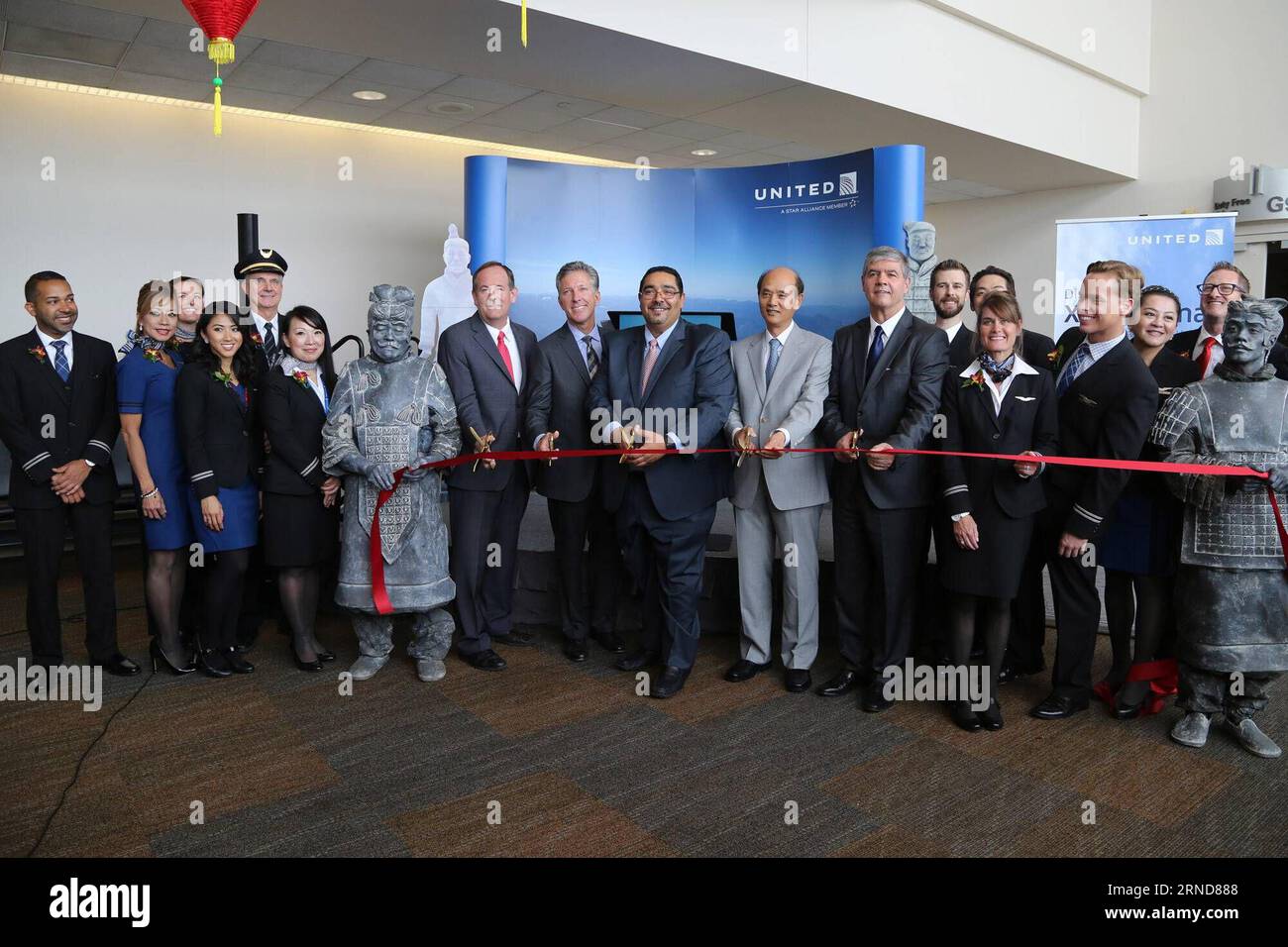 (160509) -- SAN FRANCISCO, May 9, 2016 -- Chinese Consul General in San Francisco Luo Linquan (5th R), United Airlines vice president of Atlantic and Pacific sales Marcel Fuchs (4th R) and other guests cut the ribbon for the United s inaugural nonstop flight from San Francisco to China s Xi an at the San Francisco International Airport, United States, on May 8, 2016. United Airlines celebrated the launch of new nonstop flights from U.S. west coast city San Francisco to Chinese western city Xi an at the San Francisco International Airport on Sunday. The three-times-weekly seasonal service, the Stock Photo