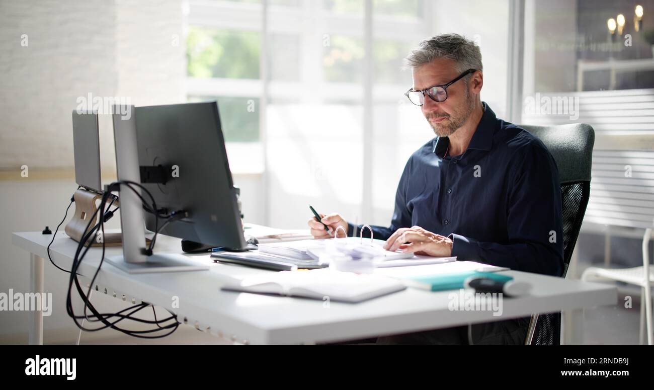 Business Accountant Accountant And Bookkeeper. Invoice And Calculator Stock Photo
