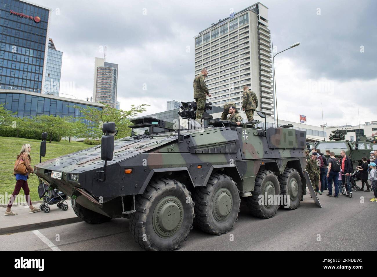 (160515) -- VILNIUS, May 14, 2016 -- People are viewing the military vehicles in Vilnius, Lithuania, May 14, 2016. Lithuania celebrates Armed Forces and Public Unity Day in it s captial on Saturday. Troops of Lithuania, Germany, U.S., Luxembourg, Portugal, etc. brought their light weapons, military vehicles and other equipment to the public. Fighting Falcon F-16 of Portuguese air force and Black Hawk of the U.S. air force participated in the performance. ) LITHUANIA-VILNIUS-ARMED FORCES AND PUBLIC UNITY DAY AlfredasxPliadis PUBLICATIONxNOTxINxCHN   160515 Vilnius May 14 2016 Celebrities are VI Stock Photo