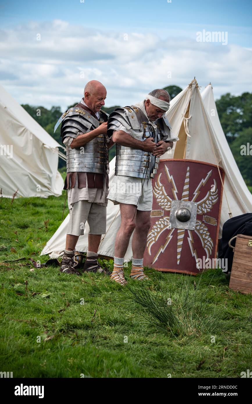 Soldiers preparing for battle at Hadrians Wall Live! - The Big Roman Soldier Event.  Birdoswald, Cumbria, 5th September 2015. Stock Photo